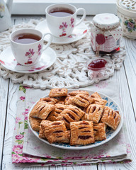 Homemade cookies from puff pastry with strawberry jam
