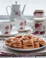 Homemade cookies from puff pastry with strawberry jam