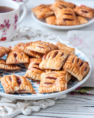 Homemade cookies from puff pastry with strawberry jam
