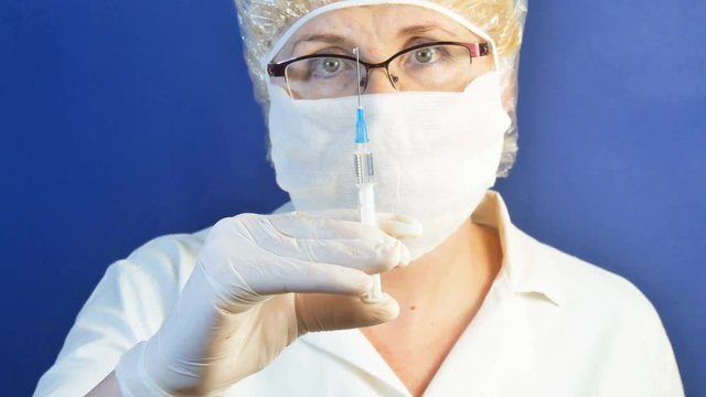 Medical worker with syringe