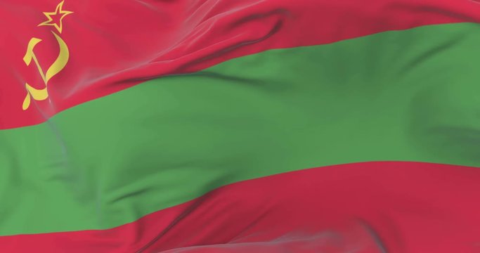 Transnistria flag waving at wind in slow with blue sky, loop