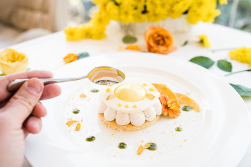 confectionery cheesecake recipe concept. tasting ready made dessert. celebrative food. floral decoration.