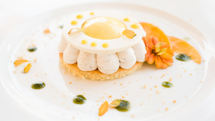 soft and delicious cheesecake on white background. dessert for children. floral decoration. confectionery art.