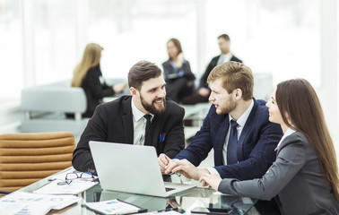 successful business team working on laptop and making the current financial report