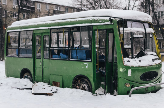 The abandoned passenger bus after the explosion. Inside, you can see broken armchairs and broken glass