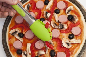 man is cooking pizza