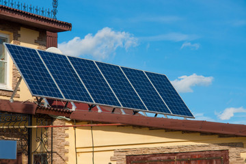 Fototapeta premium Solar energy panels on the roof of the house. aternative energy. Solar battery.