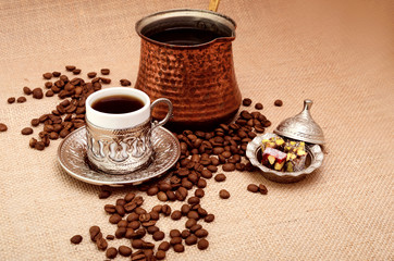 Turkish Coffee and cezve coffee pot with turkish delight