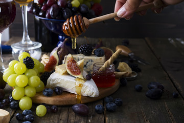 White wine, grape, bread, honey and cheese