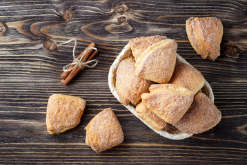 Homemade cinnamon cookies on rustic wooden table. Top view.