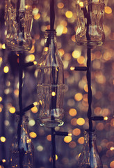 Empty bottles and christmas lights used as outdoors christmas decoration