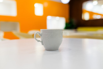White Cup on the white table.