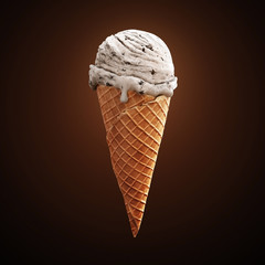 Highly detailed delicious vanilla ice cream with chocolate crumbs in waffle cone isolated on dark background. 3D illustration