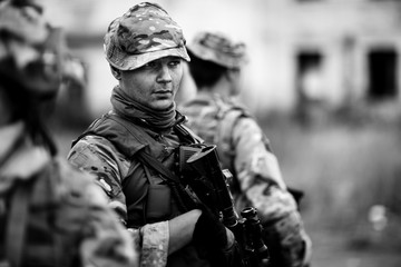 Army soldier during the military operation in the city. war, army, technology and people concept.