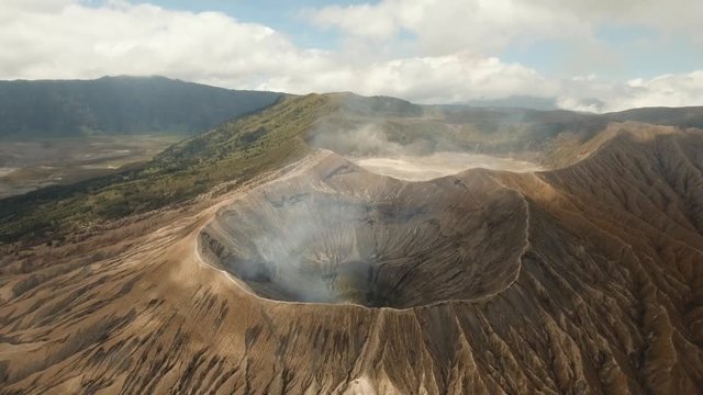 Mountain Bromo active volcano crater in East Jawa, Indonesia. Aerial view of volcano crater Mount Gunung Bromo is an active volcano,Tengger Semeru National Park. 4K video. Aerial footage.