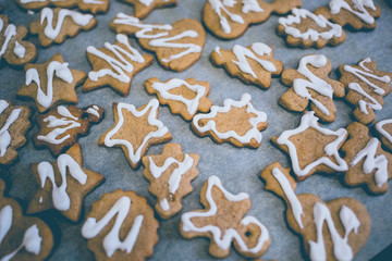 Vanilla cookies on white baking paper sheet.