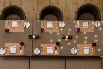 Long restaurant table for six people in overhead view. 