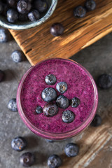 Fresh juicy blueberry smoothies in the glass. Simple background. Healthy food. Detox. Lifestyle. Top view