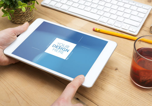 Mockup of Tablet User at Wooden Desk 1