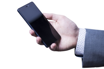 Closeup of a hand of businessman in grey suit holding mobile phone.