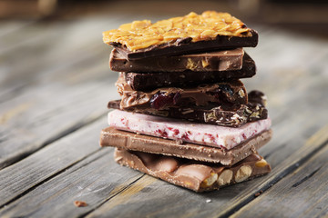 Mix of sweet swiss choccolate on the wooden table
