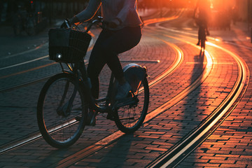 Blurred of people riding bicycle during the sunset in the city of Bordeaux in vintage style and...