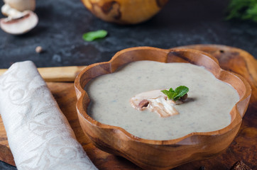 Creamy Mushroom Soup on rustic wooden table