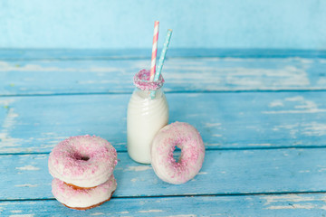 Tasty donuts with pink sprinkles