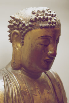 Traditional oriental ancient sculptural Buddha image of metal with lost elements