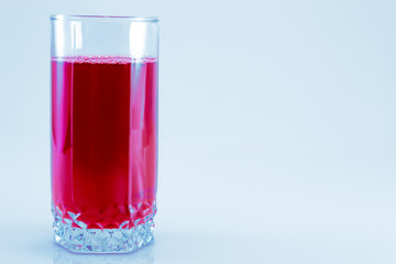 glass of fresh cranberry juice isolated on white background, top view