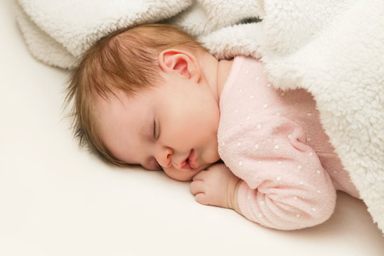 Portrait of adorable newborn baby girl sleeping