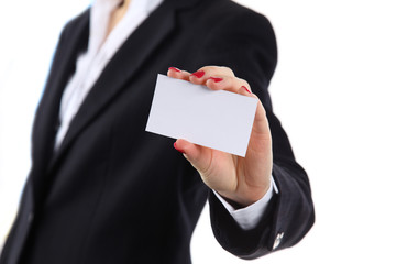 Female hand holding business card in office