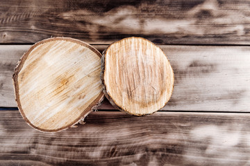 Two wooden cut texture on wooden background.