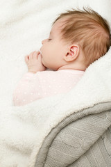 Portrait of adorable newborn baby girl sleeping
