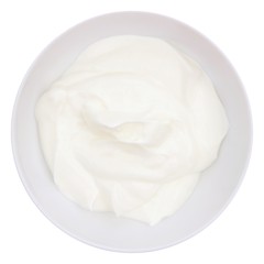 Creamy Greek yogurt in a white bowl, above view isolated on a white background