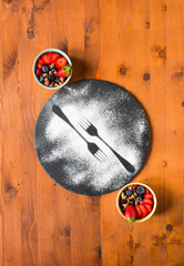 Cereal. Breakfast with muesli, and fresh fruits in bowls on a rustic wooden background,