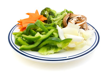 Platter of assorted fresh vegetables on white