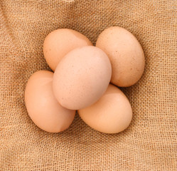 Raw eggs isolated on purlap