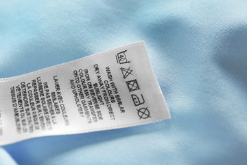 Clothing label with laundry instructions, closeup