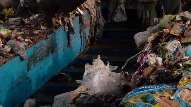 Processing of waste, garbage. Urban landfill. Sorting. Montain garbage. Ecology.