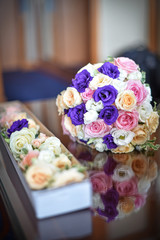 beautiful bouquet of rose flowers, on table .wedding bouquet  from red roses.elegant wedding bouquet on table at restaurant .Wedding decoration on table. Floral arrangements and decoration