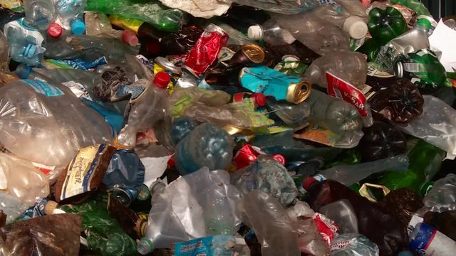 Processing of waste, garbage. Urban landfill. Sorting. Montain garbage. Ecology.