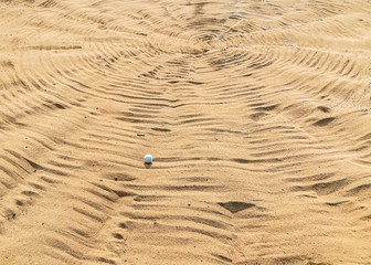 golf ball in sand bunker