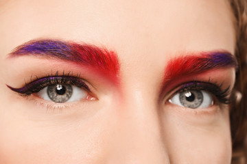 Naklejka premium Young woman with dyed eyebrows, closeup