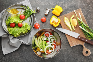 Composition with ingredients for tasty vegetable salad on table