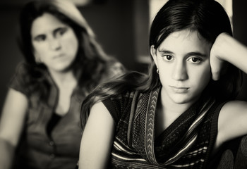 Defiant teenage girl and her worried mother