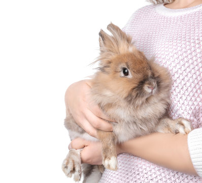 Woman holding funny funny rabbit on white background