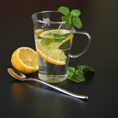 still life of fresh fruits and herbs on a dark background close up