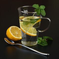 still life of fresh fruits and herbs on a dark background close up