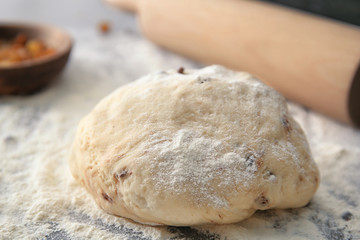 Raw dough with chocolate chips on table